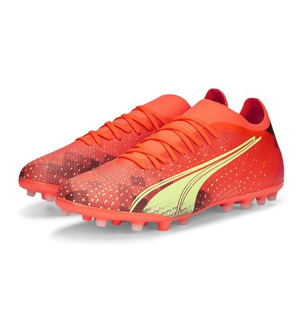 Orange Puma Ultra Match MG adult football cleats for outdoor soccer, featuring sport and outdoor design with textured sole.