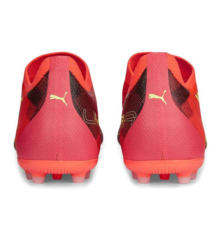 Orange Puma Ultra Match MG football shoes for adults, designed for outdoor soccer, with a sleek sporty look.