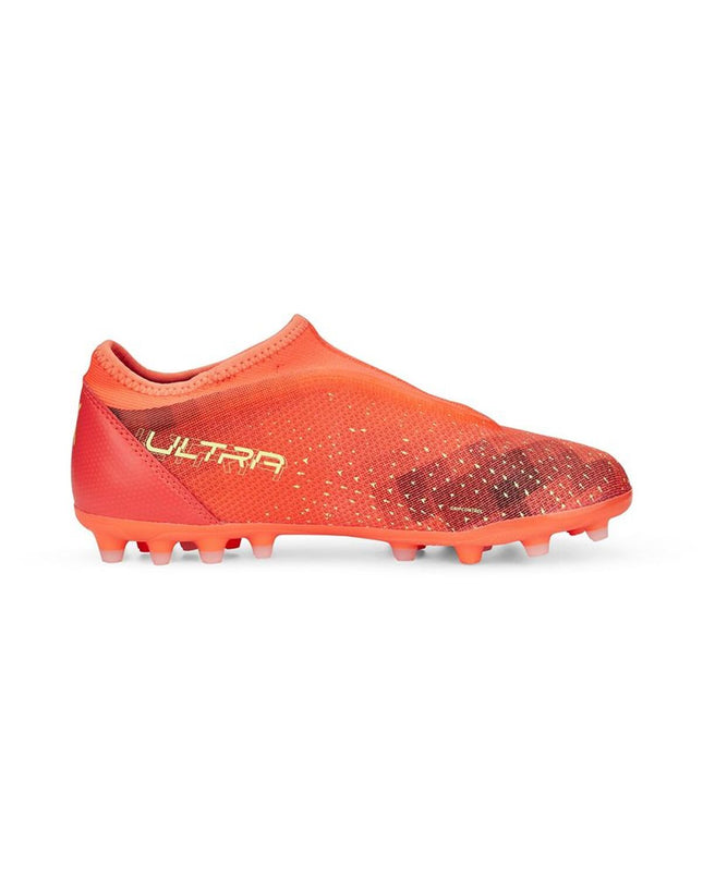 Puma Ultra Match LL MG orange football shoes for kids, sporty outdoor soccer footwear with lightweight design and grip sole.