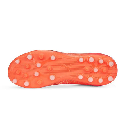 Orange Puma Ultra Match LL MG football shoes with black accents, designed for outdoor soccer, featuring a sleek sport style.