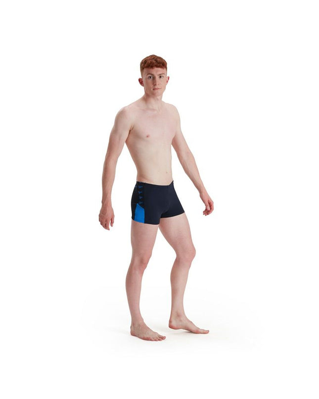 Dark blue men's Speedo swim trunks for sports and watersports, featuring a snug fit and athletic design.