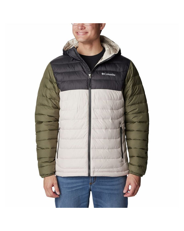 Columbia beige sport and outdoor jacket for camping and hiking, size small, shown on a hanger with outdoor gear in the background.