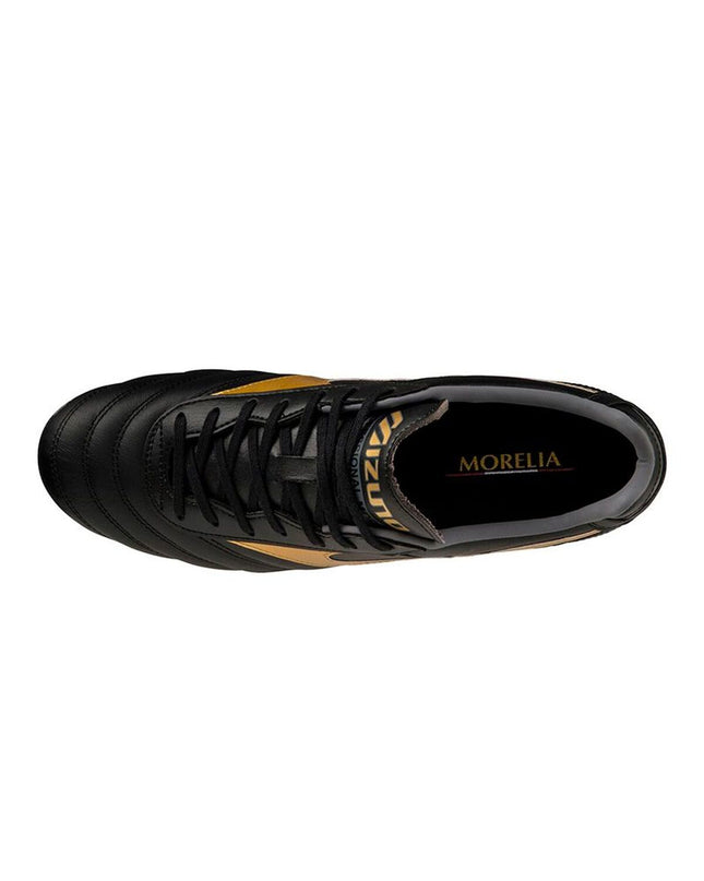 Mizuno adult football cleats for outdoor soccer, black and white sport shoes with textured sole and branding, designed for performance.