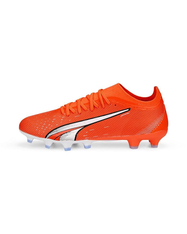 Dark orange Puma adult football cleats for sport and outdoor play, featuring lightweight design and firm ground studs.