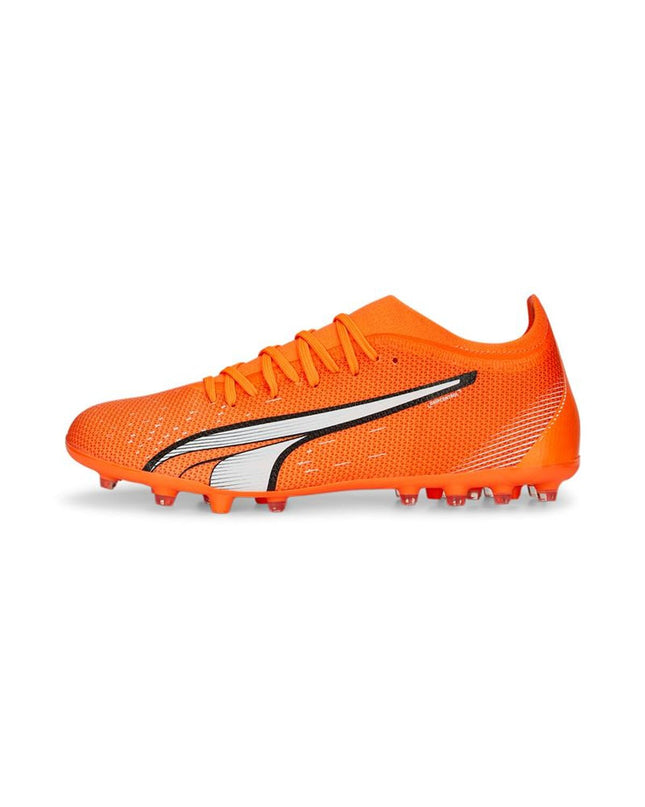 Adult Puma soccer cleats for sport and outdoor use, featuring black and white design with brand logo visible.