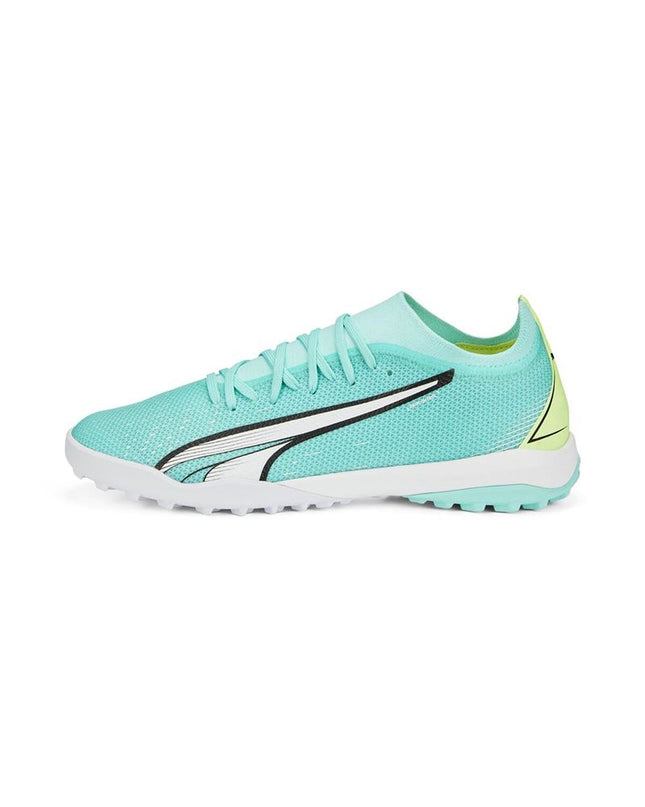 Adult Puma soccer cleats for sport and outdoor use, with black and white design, shown on a plain background.