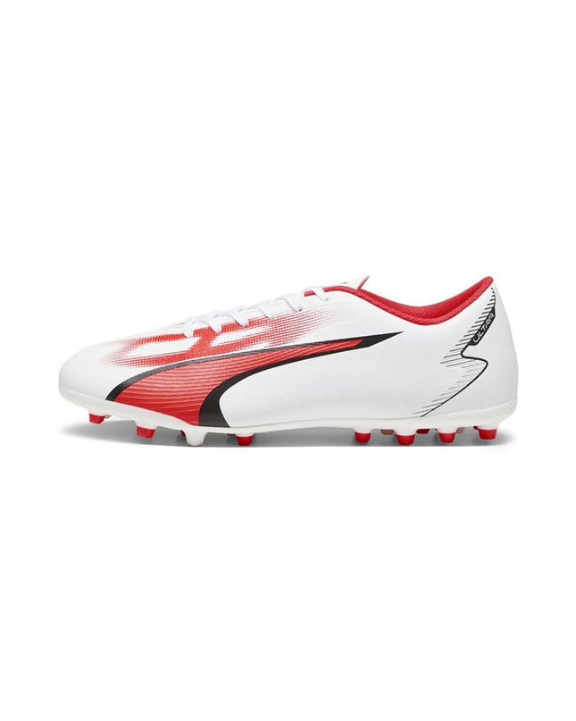Adult Puma football shoes for outdoor sports, black and white soccer cleats with Puma logo and studded soles.