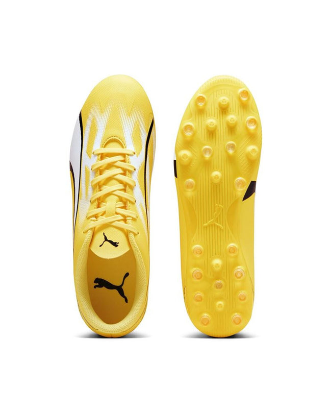 Yellow Puma Ultra Play MG adult football shoes for outdoor soccer, featuring a sporty design and durable outsole.