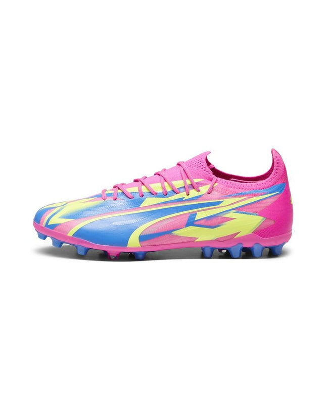 Black Puma adult football shoes for outdoor soccer with studded soles, designed for optimal grip and performance.