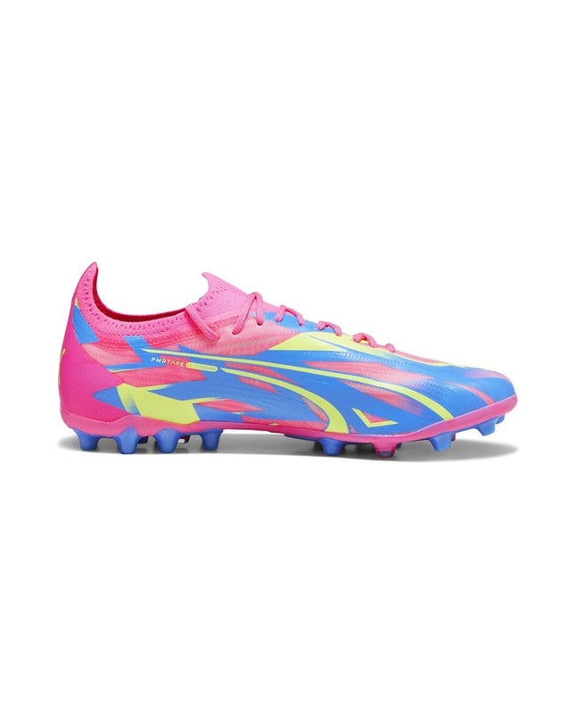 Adult Puma soccer shoes for outdoor football, featuring black and white design with Puma branding and textured sole.