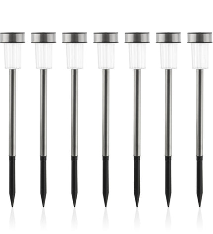Set of seven Progarden Oh My Home Torch Garden Solar Lamps for outdoor garden decoration, with black metal posts and glowing torches