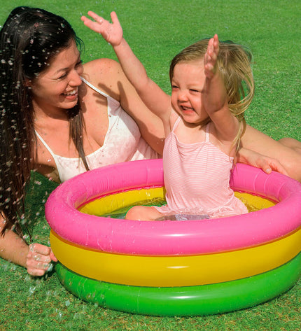 Set of 12 Intex Sunset Glow inflatable kiddie pools with colorful ring designs, ideal for outdoor play and summer fun.