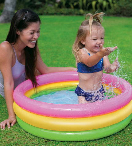 Six Intex Sunset Ringen inflatable kiddie pools, colorful round pools with blue, yellow, and red rings, suitable for summer outdoor play.
