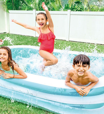 Two Intex inflatable swimming pools in white and green, measuring 262 x 56 x 175 cm, suitable for garden use.
