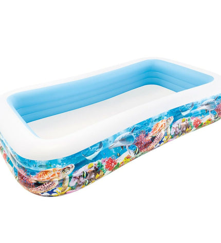 Two Intex inflatable children's pools with tropical design, measuring 305 x 56 x 183 cm, filled with water in a garden setting.