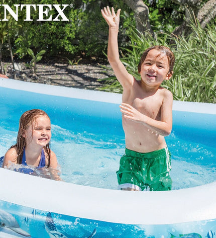 Two Intex inflatable kids' pools with tropical design, measuring 305 x 56 x 183 cm, suitable for outdoor garden use.