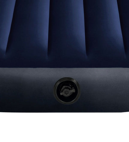 Six Intex Classic Downy air mattresses for camping and outdoor use, measuring 76 x 25 x 191 cm, stacked in a storage setting.