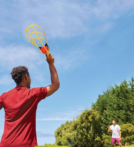 Wham-O racquet set with three lightweight plastic racquets in bright colors, designed for outdoor play and sports activities.