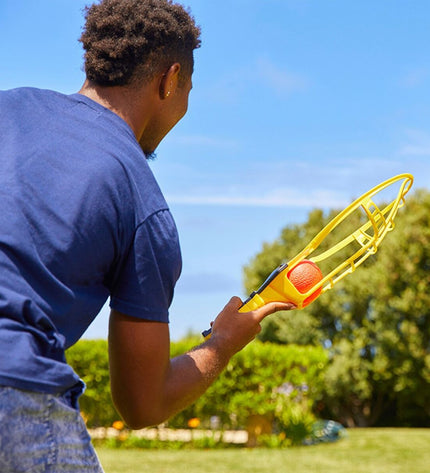 Wham-O racquet set with three colorful lightweight plastic racquets in a 20x55x10 cm size for outdoor play and games.