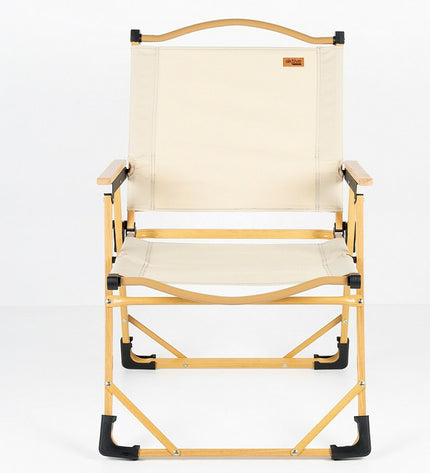 Two Aktive Sabana foldable camping chairs in black, lightweight design, set up outdoors on grassy ground for camping or outdoor activities.