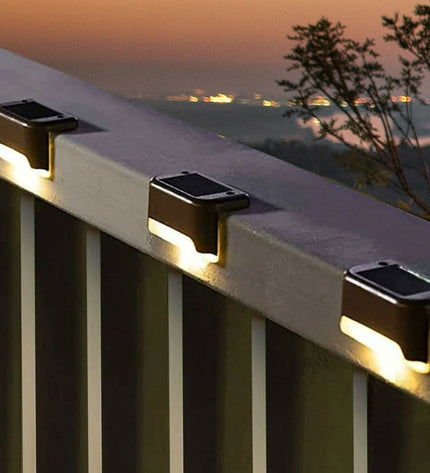 Set of 12 Aktive outdoor garden decorative solar lights in black, measuring 8 x 4.5 x 4 cm, for outdoor illumination and ambiance.