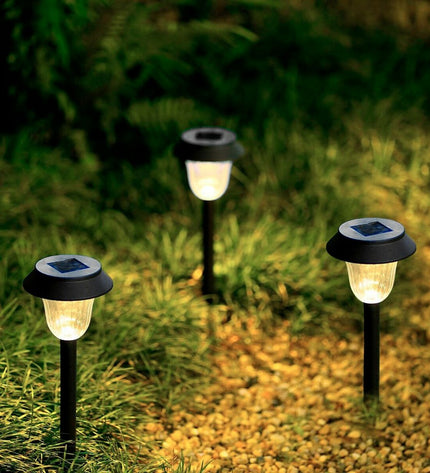 Set of four Aktive solar garden lights with stainless steel and plastic, measuring 10x38x10 cm, for outdoor decoration.