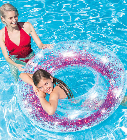 Six transparent purple inflatable donut pool floats by Intex, each with a 119 cm diameter, ideal for outdoor water fun.