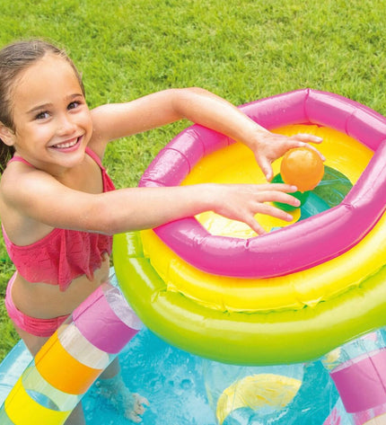 Two Intex inflatable children's rainbow pools, 374 L capacity, measuring 295 x 109 x 191 cm, set up outdoors in the garden.