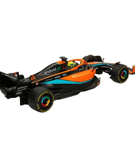 Two McLaren F1 MCL36 remote control toy cars in 1:12 scale, detailed plastic vehicles from the McLaren brand.