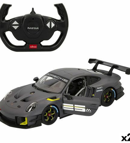 Two Porsche remote-controlled toy cars, detailed miniature vehicles for play and collection, featuring authentic Porsche design.