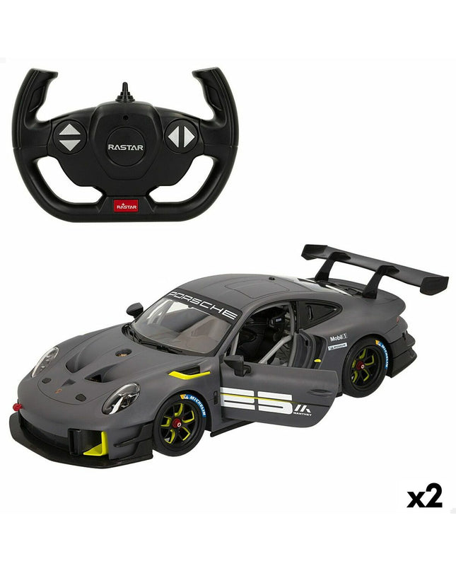 Two Porsche remote-controlled toy cars, detailed miniature vehicles for play and collection, featuring authentic Porsche design.
