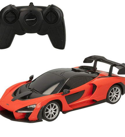 Two McLaren remote-controlled toy cars in red and blue, detailed miniature vehicles for play and collection.
