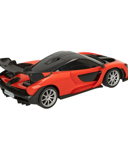 Two McLaren remote-controlled toy cars, detailed miniature vehicles perfect for play and collection.