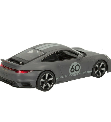 Two Porsche 911 remote control toy cars in 1:16 scale, detailed miniature vehicles for play and collection.