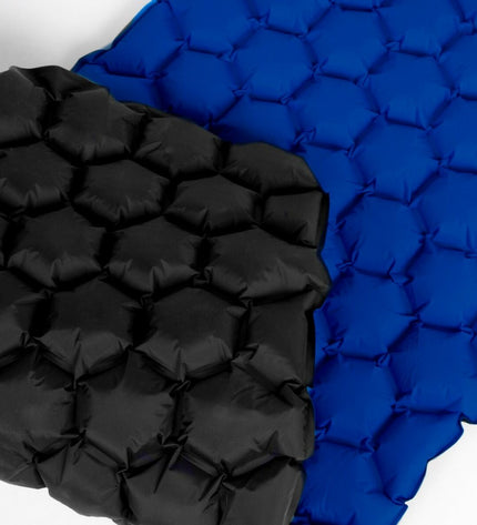 Aktive TPU camping and outdoor mat, 185 x 15 x 57 cm, suitable for hiking and outdoor activities, rolled out on a camping site.