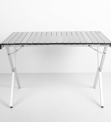 Two Aktive foldable camping tables, 108 x 72 x 71 cm, suitable for outdoor activities and camping in a natural setting.