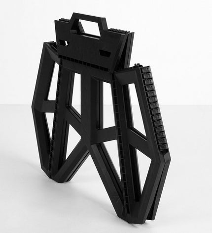 Set of four Aktive foldable outdoor chairs in black with compact design, suitable for camping and hiking.