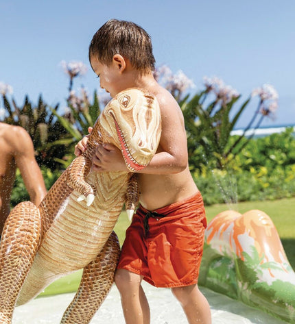 Intex PVC speelgoed watersproeier for outdoor play, measuring 201 x 36 x 201 cm, set up on grass for kids' water fun.