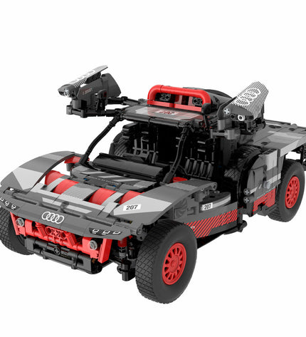 Audi Bouwspel auto toy with 432 building parts, featuring detailed miniature car components in vibrant colors.