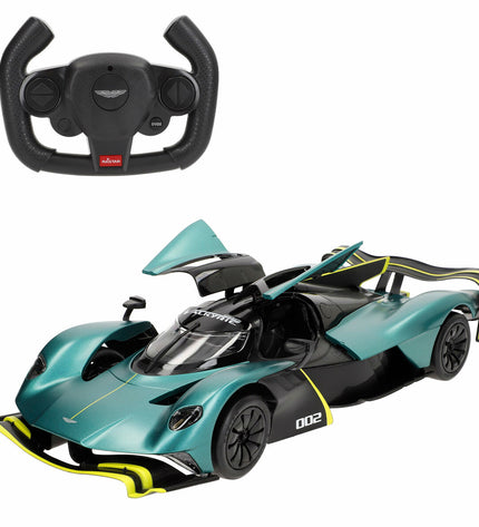 Two Aston Martin remote control police cars, 1:14 scale, toy vehicles with detailed police design and size approximately 36x8x14 cm.