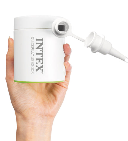 Intex electric air pump for outdoor camping and sports, showing the compact pump with nozzle attachments in a camping setting