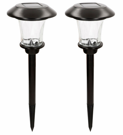 Set of four Aktive outdoor garden decorative solar lamps, 15x49x15 cm, illuminated for outdoor ambiance and landscape decor.
