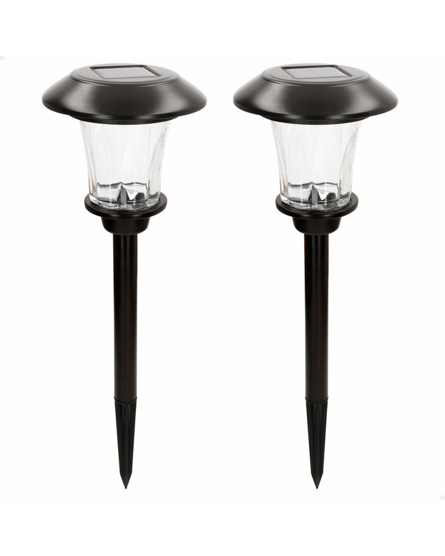 Set of four Aktive outdoor garden decorative solar lamps, 15x49x15 cm, illuminated for outdoor ambiance and landscape decor.