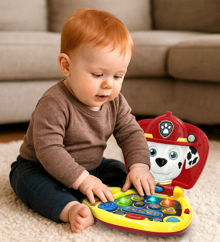 Four multicolored Paw Patrol electronic toy computers, 20x17x14 cm, featuring bright buttons and playful paw print designs.