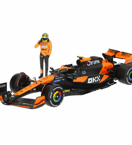 Set of four McLaren F1 2024 toy cars, detailed miniature vehicles from the McLaren brand for play and collection.