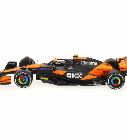 Set of four McLaren F1 2024 toy cars, detailed miniature vehicles in bright colors, perfect for play or display