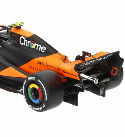 Set of four McLaren F1 2024 toy cars, detailed miniature vehicles from the McLaren brand, for play and collection.