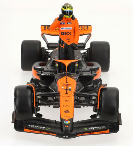 Set of four McLaren F1 2024 toy cars, detailed miniature vehicles from the McLaren brand in vibrant colors.