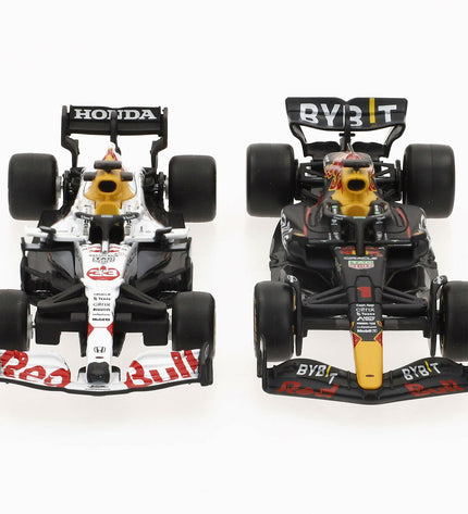 Set of four Red Bull Verstap toy cars, colorful die-cast vehicles for children, in a playful display.