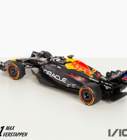 Two Red Bull F1 2023 remote-controlled toy cars in 1:10 scale, featuring detailed design and vibrant red and blue colors.